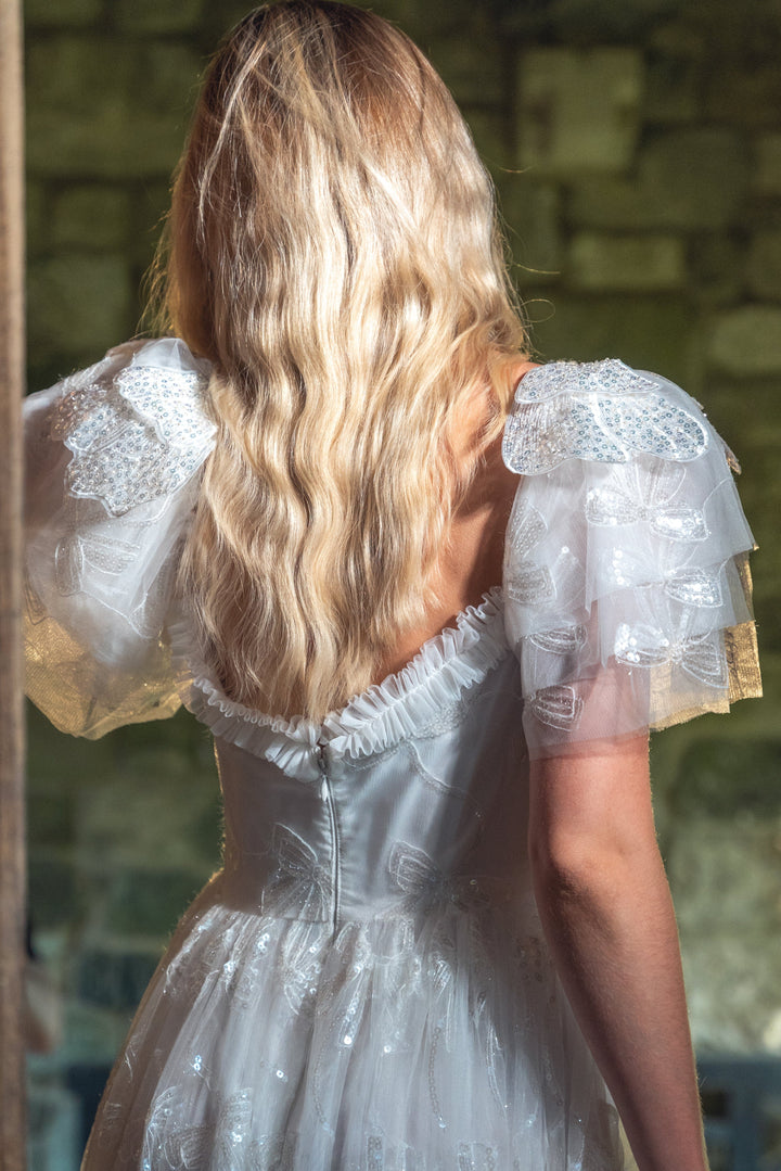 Vestido midi con lentejuelas y lazo de ángel